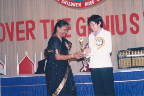 In the 3rd National competition Mrs Vijaya Lakshmi receiving a momento on behalf of a participant - Thej Academy